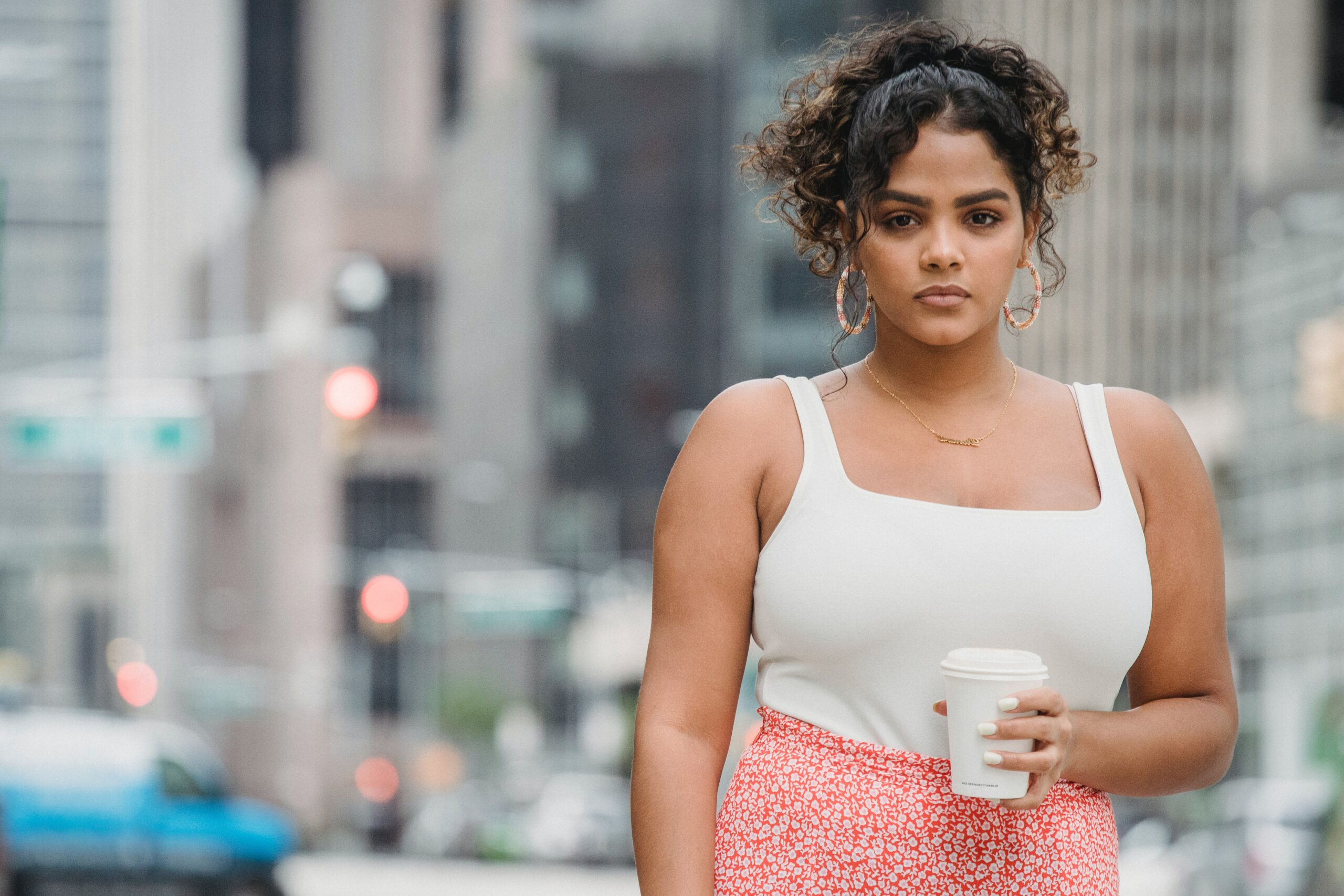 Lady Wearing Designer Dress With Coffee in Her Hands