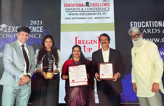 Faculty recieving award on behalf of Indian Institute of Fashion Technology for Most promising fashion technology institute and Outstanding performance in Virtual Knowledge Delivery during pandemic