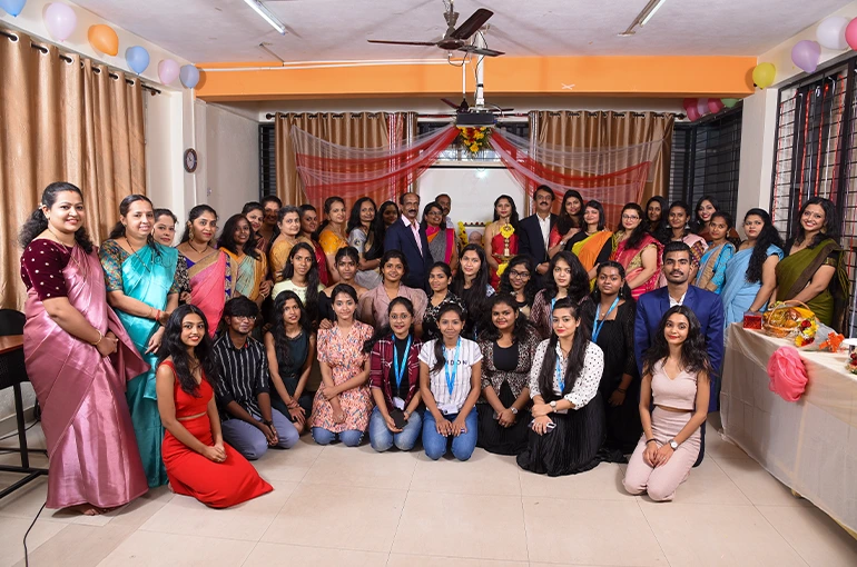 Fashion Designing Students Holding their Designs in IIFT Class Room